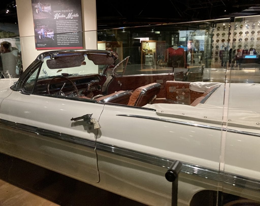Car at the Country Music Hall of Fame museum, showing detail of guns used as door handles